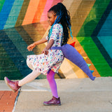 Dinosaur clothes for girls dinosaurs twirl skirt dress with pockets girl clothing twirly pocket dresses science stem paleontology girly pink purple kids pants toddler shirt t-shirt birthday dino party theme gift baby children’s child infant nerd geek nerdy geeky ethical fashion brand style scientist smart smarty pima cotton Peru outfit apparel Kansas company mom-owned circle ballet skater fit and flare diversity inclusion company fashion line apparel